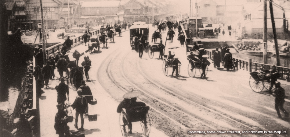 Pedestrians, horse-drawn streetcar, and rickshaws in the Meiji Era 
